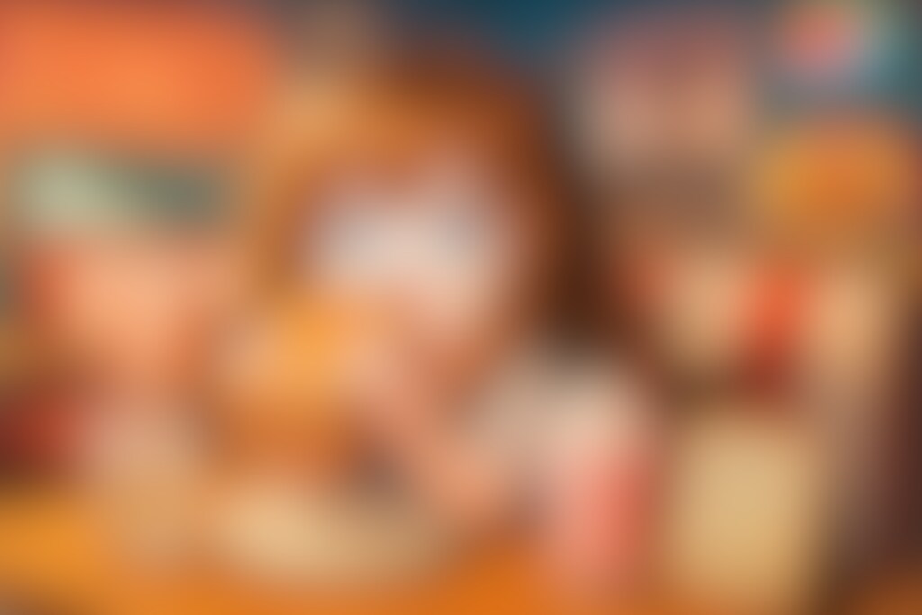 エルヴィスサンドと苺シェイクを食べる小さな女の子