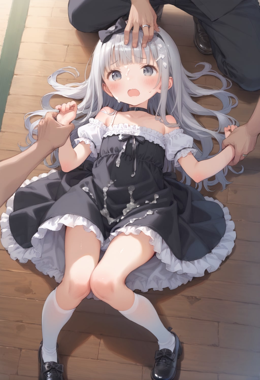 押さえつけられる子