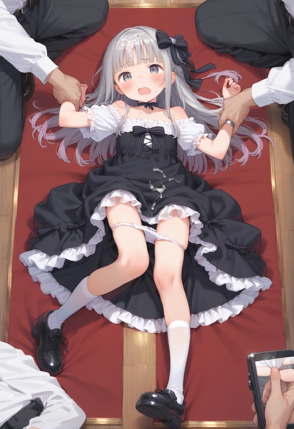 押さえつけられる子
