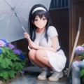 傘をさしてしゃがむ女性 3枚目