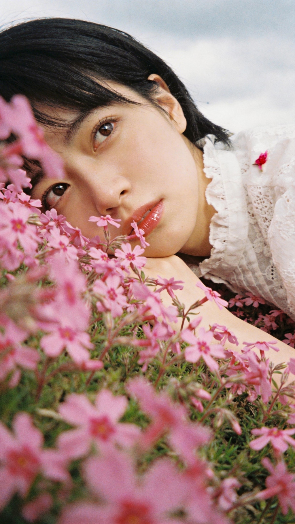 A Face Framed by Blossoming Silence