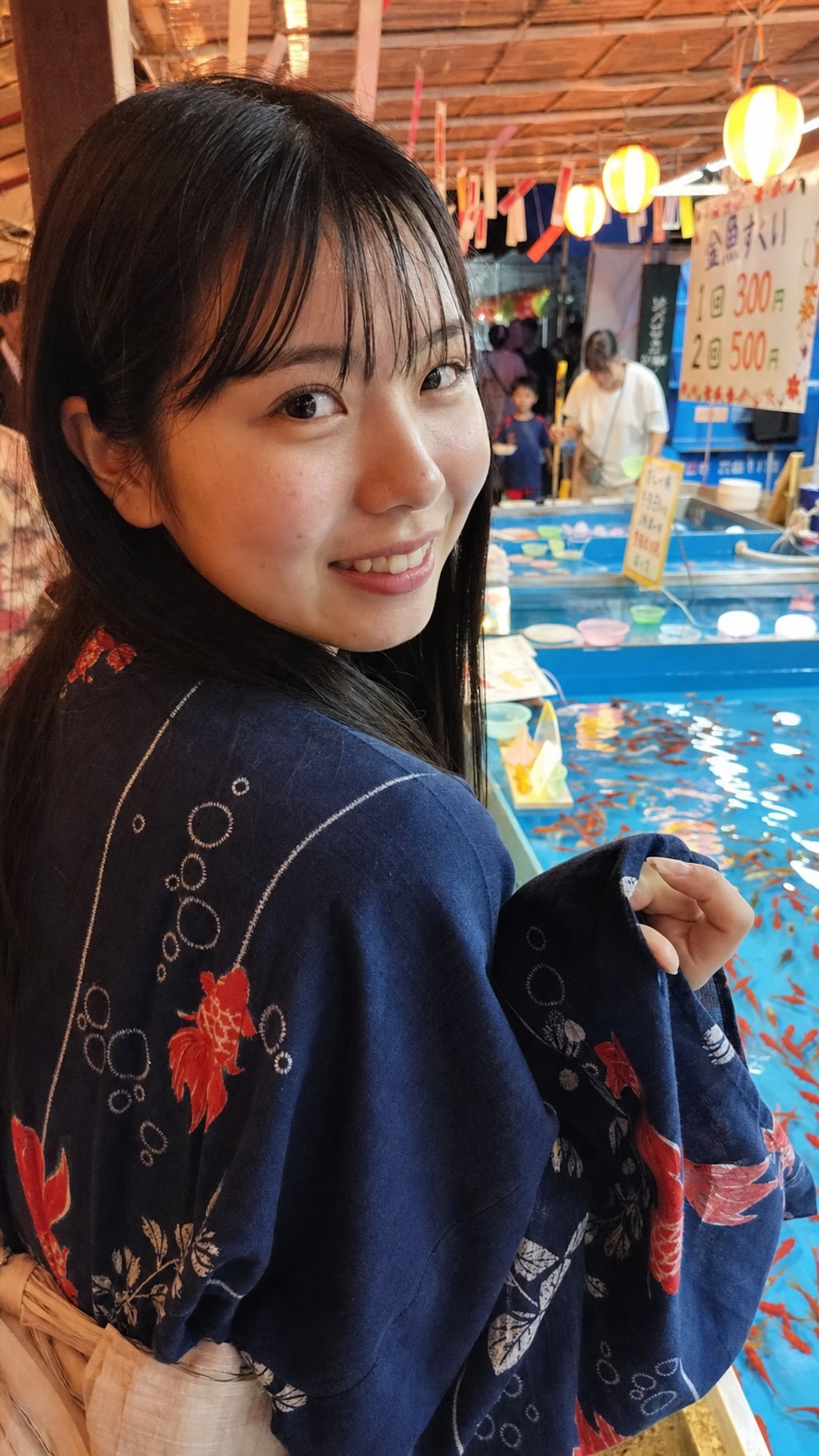 A Smile by the Goldfish Stall