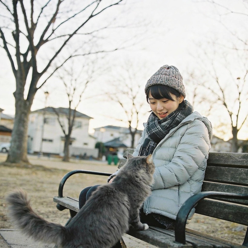 A Pensive Pause with Feline Company