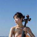 セロ引きの女性たち 6枚目