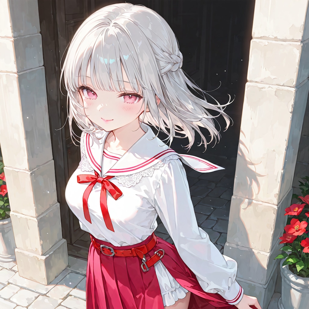 道にある赤い花