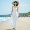 ビーチを歩く白いドレスの女性 4枚目